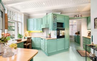 green luxury kitchen showing custom kitchen cabinets toronto