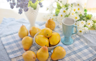 summer kitchen table with lemons and flower in vase