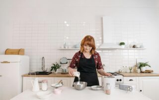 woman cooking in kitchen remodel